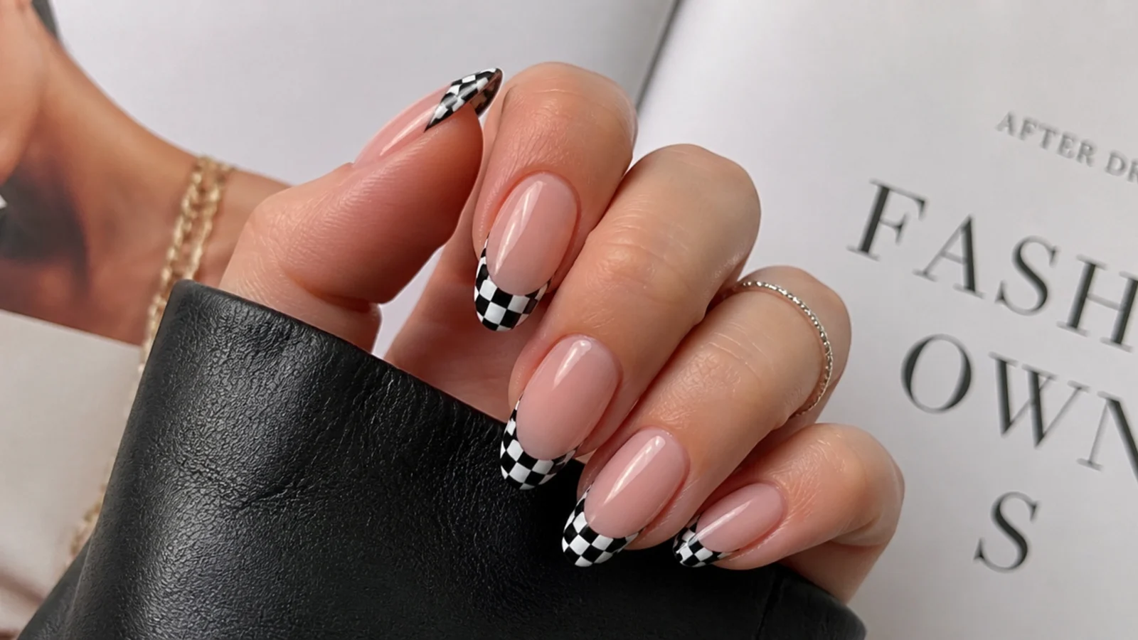 Black and white checkerboard French tip emo nails on almond nails