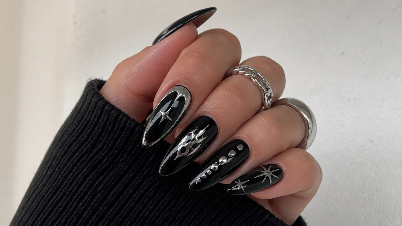 Black nails with mirror chrome silver accents, emo Y2K style