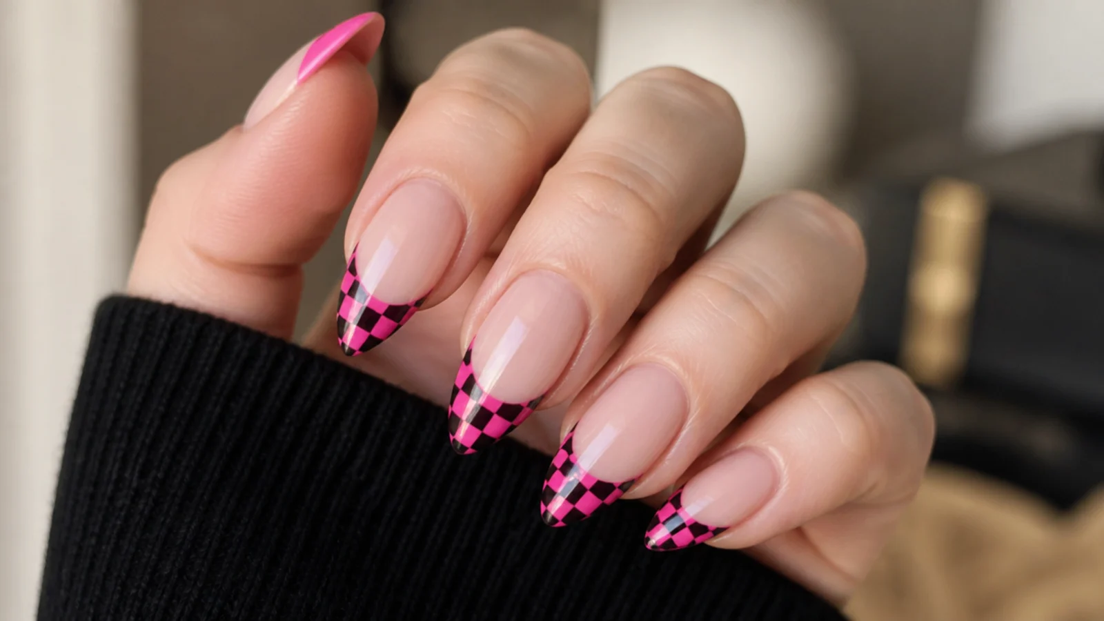 Hot pink and black checkerboard French tip emo nails on almond shape