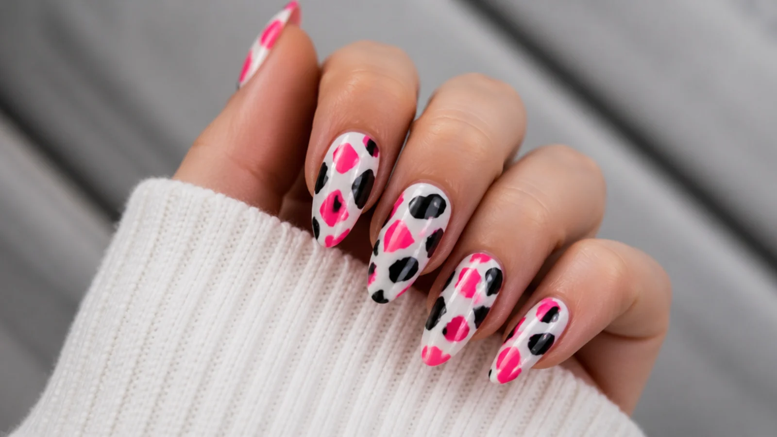 White emo nails with hot pink and black cow print patches