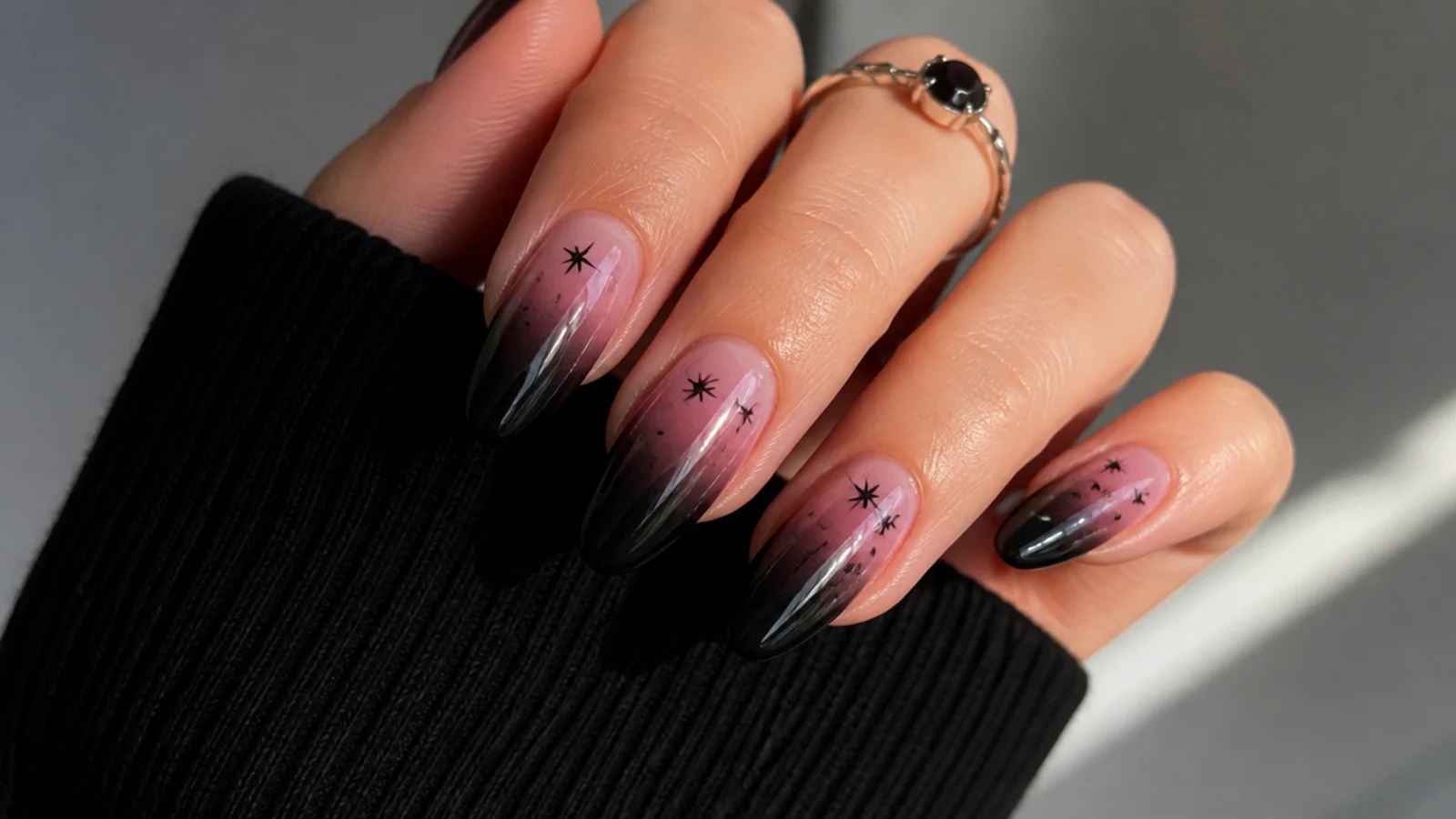 Pink to black ombre emo nails fading from cuticle to tip