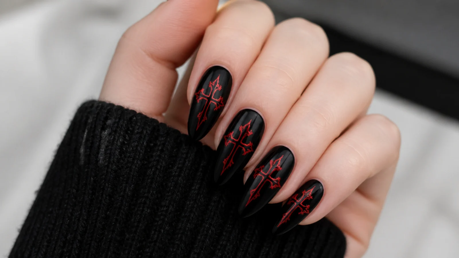 Black emo nails with small red gothic crosses