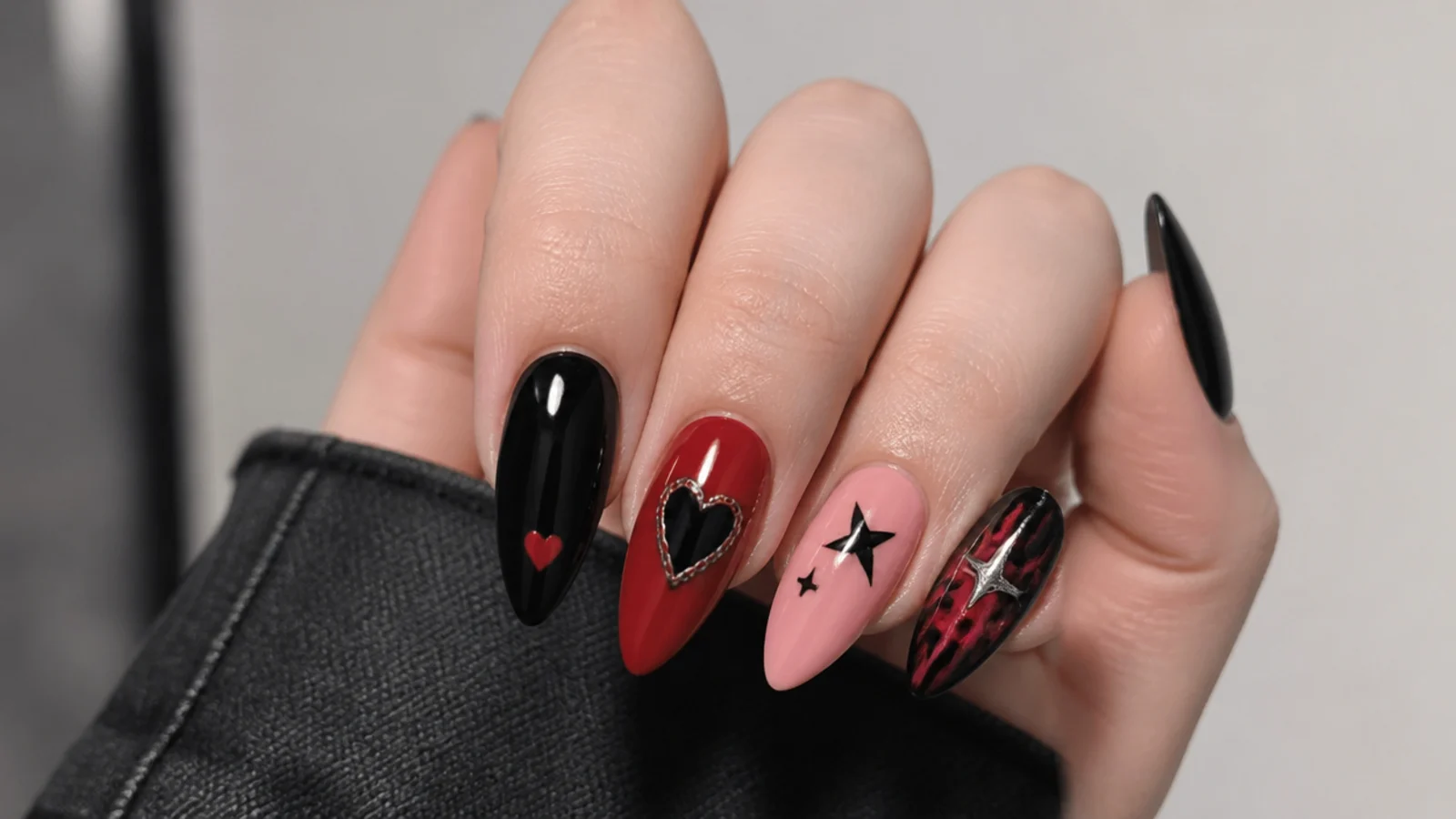 Swatches of black, blood red and pink with emo heart and star motifs