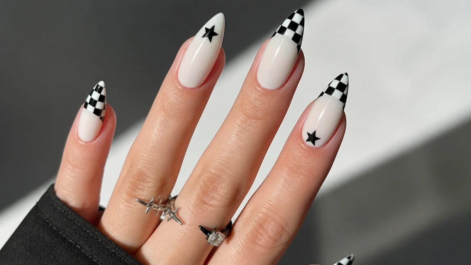 White emo nails with black-and-white checkerboard tips