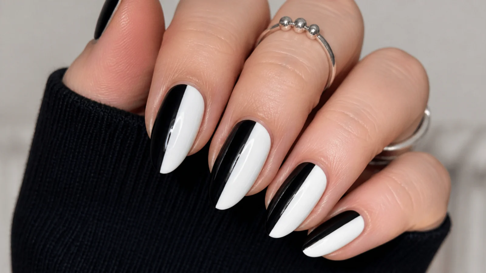 Emo nails split vertically into black and white halves