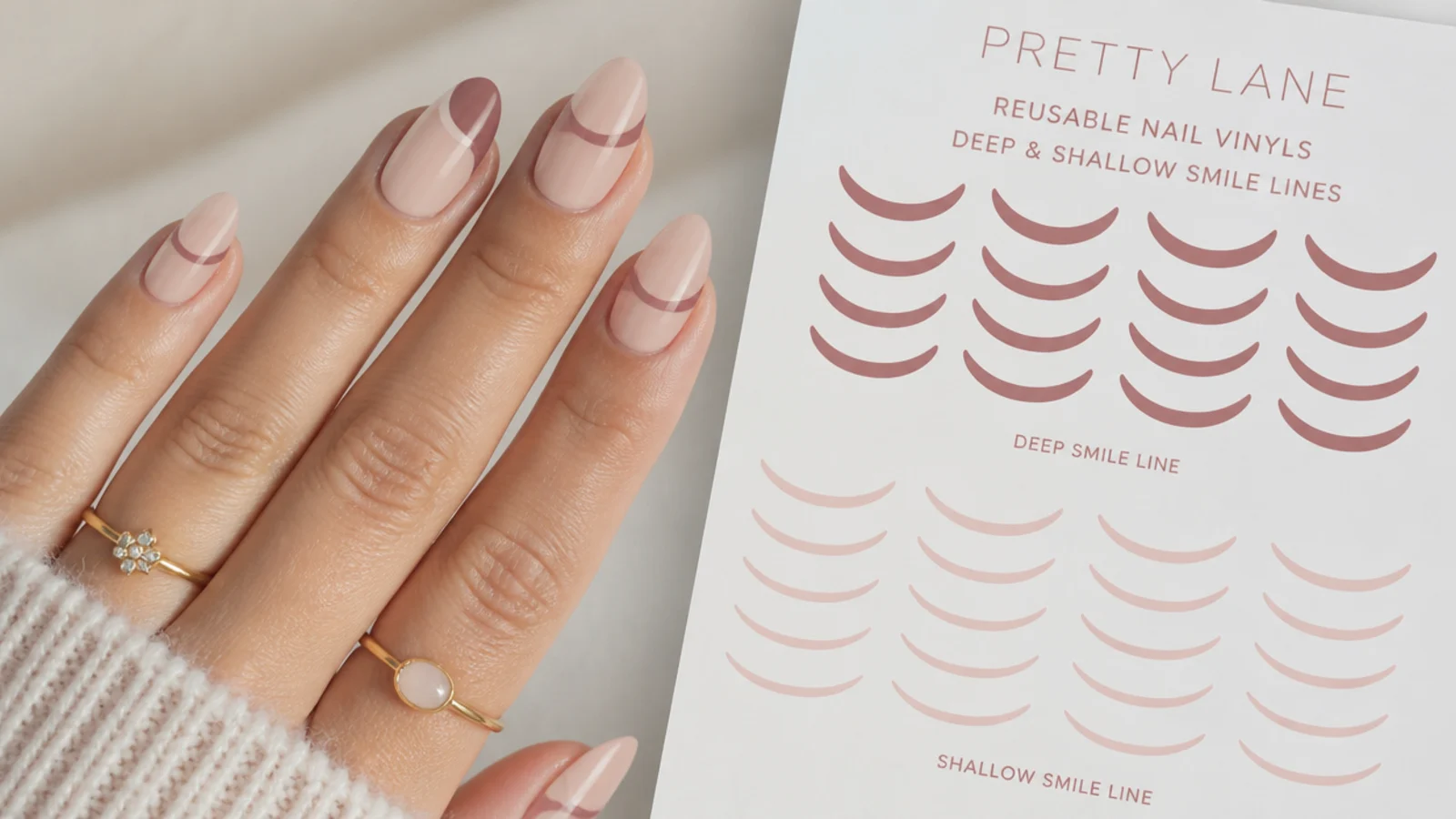 Reusable nail vinyl stencils in deep and shallow smile line curves laid out on a sheet
