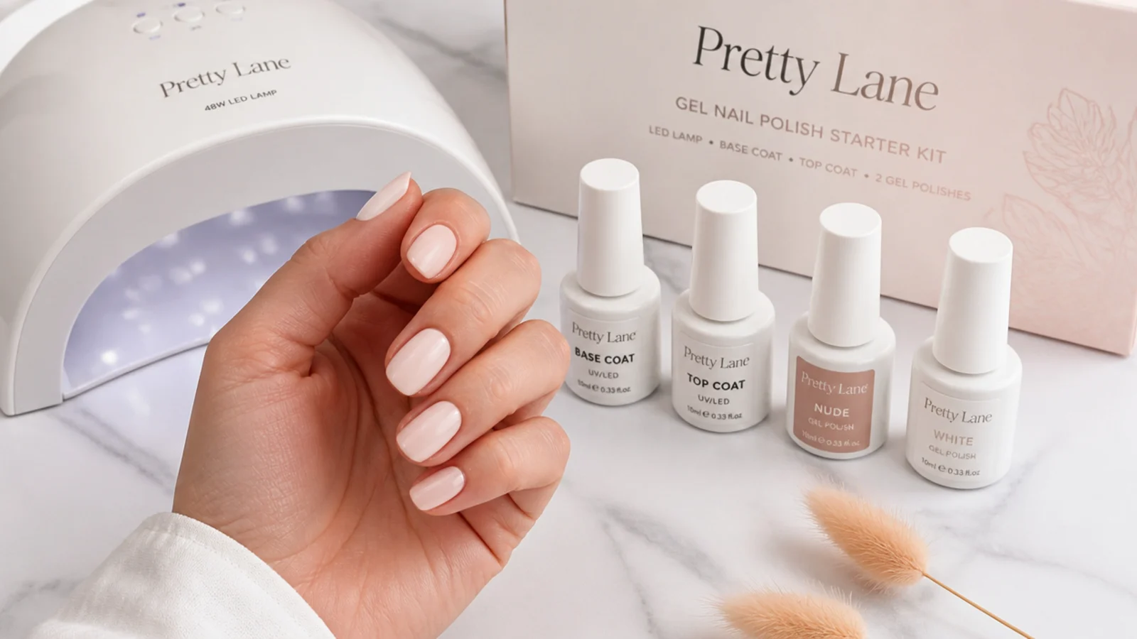 Gel nail polish starter kit with a 48 watt LED lamp, base and top coat, nude and white gel bottles