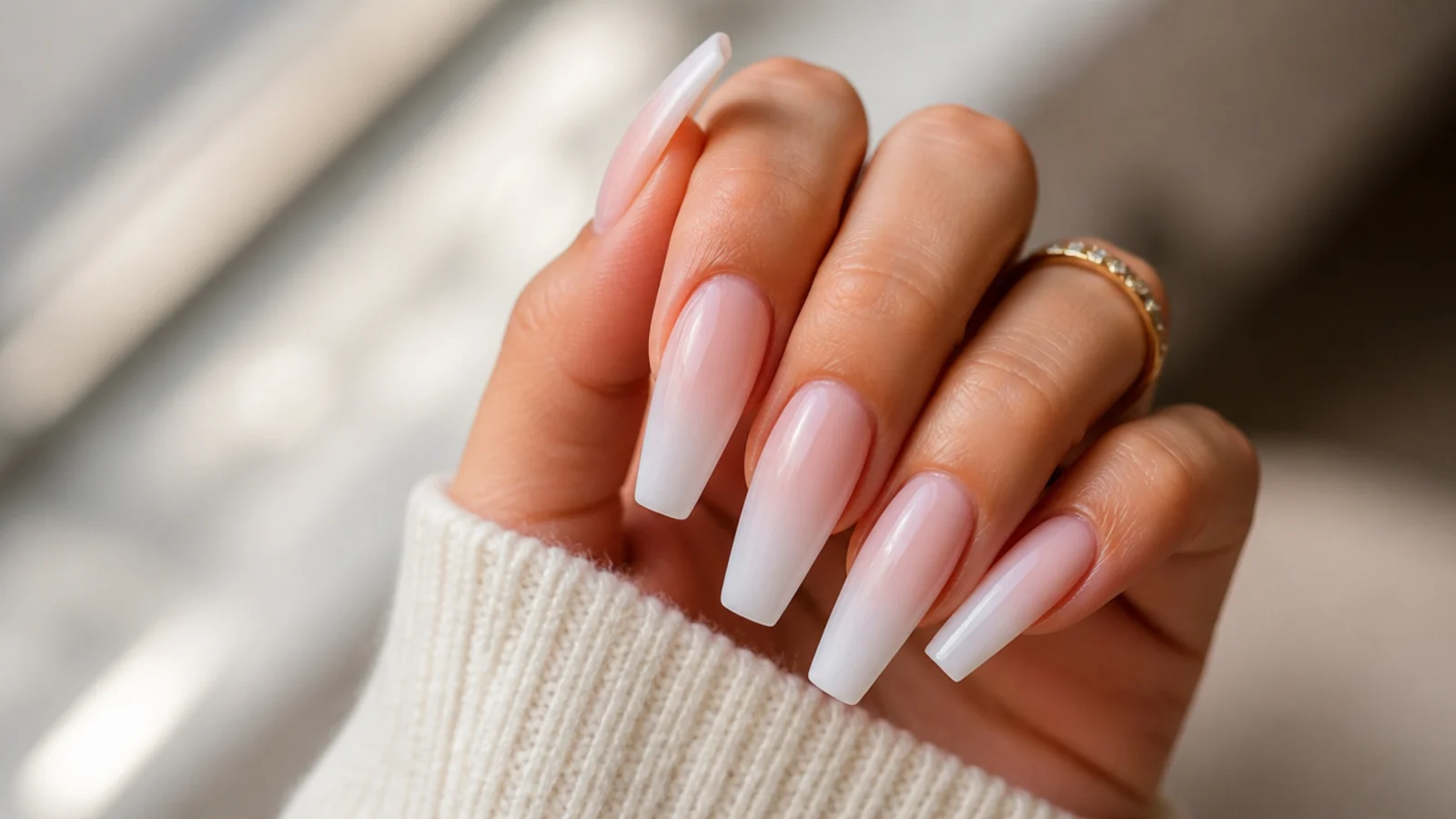 Long coffin nails with a white tip fading softly into a sheer pink base with no visible line