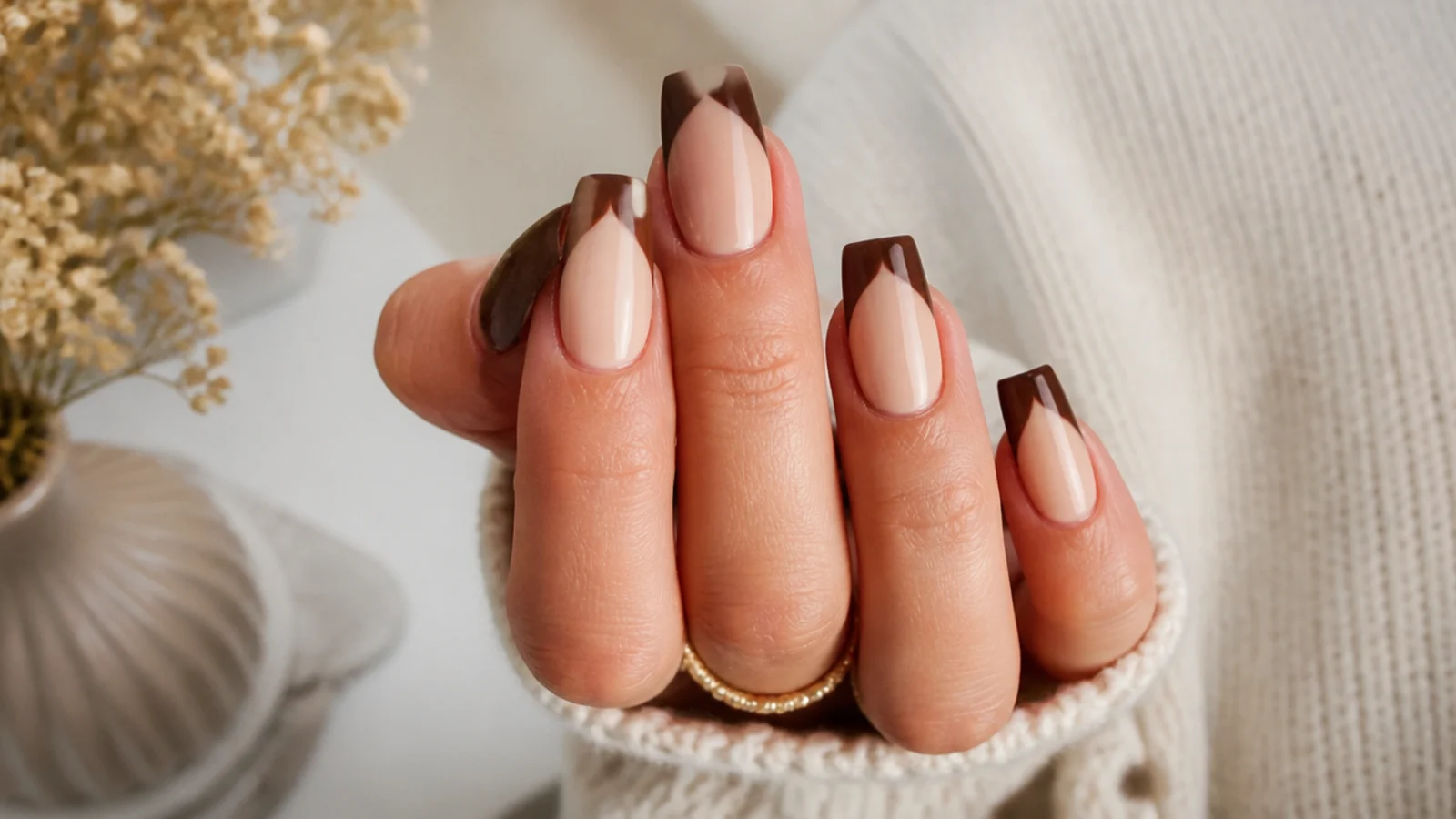Medium coffin nails with espresso brown French tips over a warm beige base
