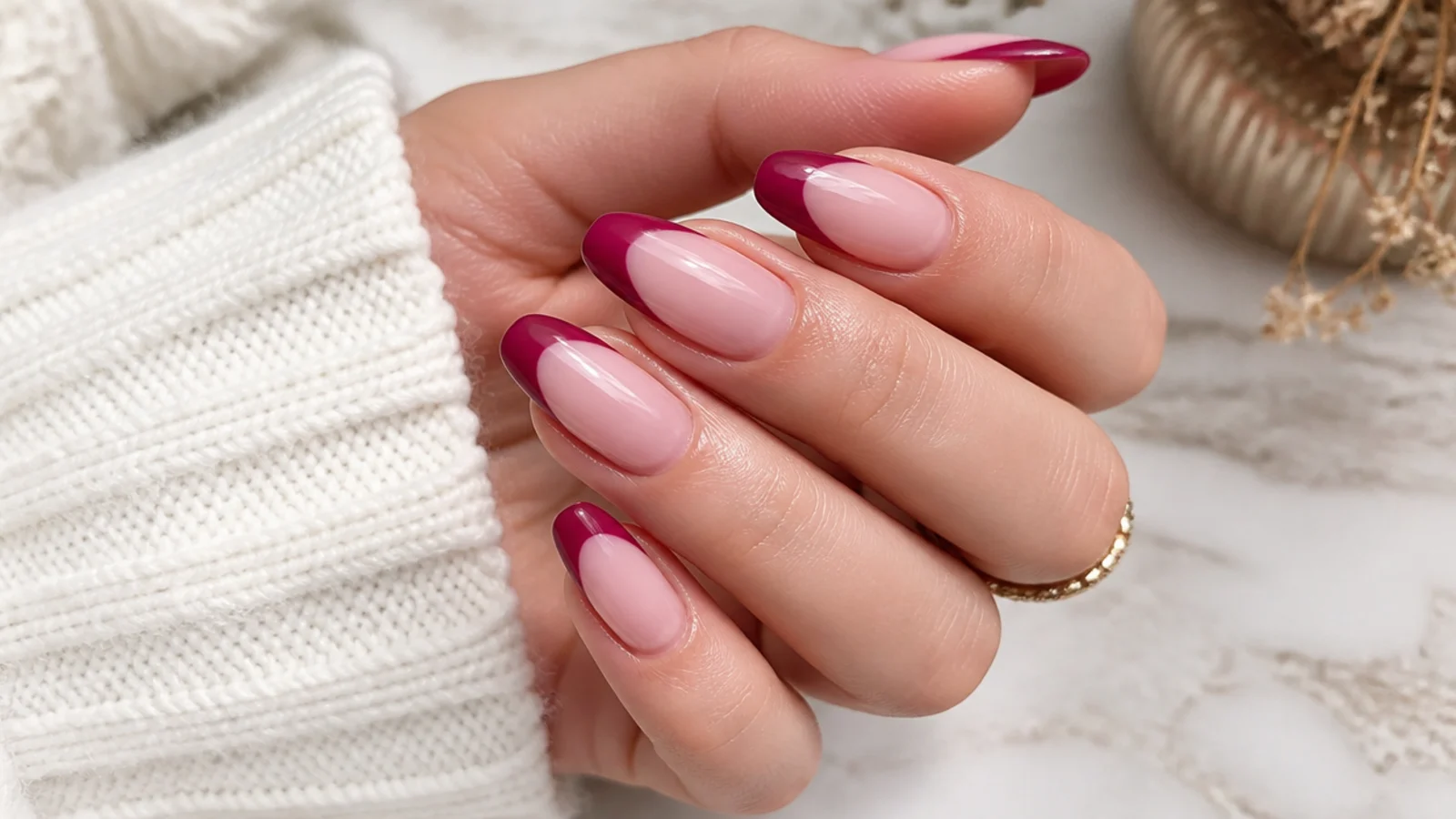 Long almond nails with deep magenta French tips following the tapered curve