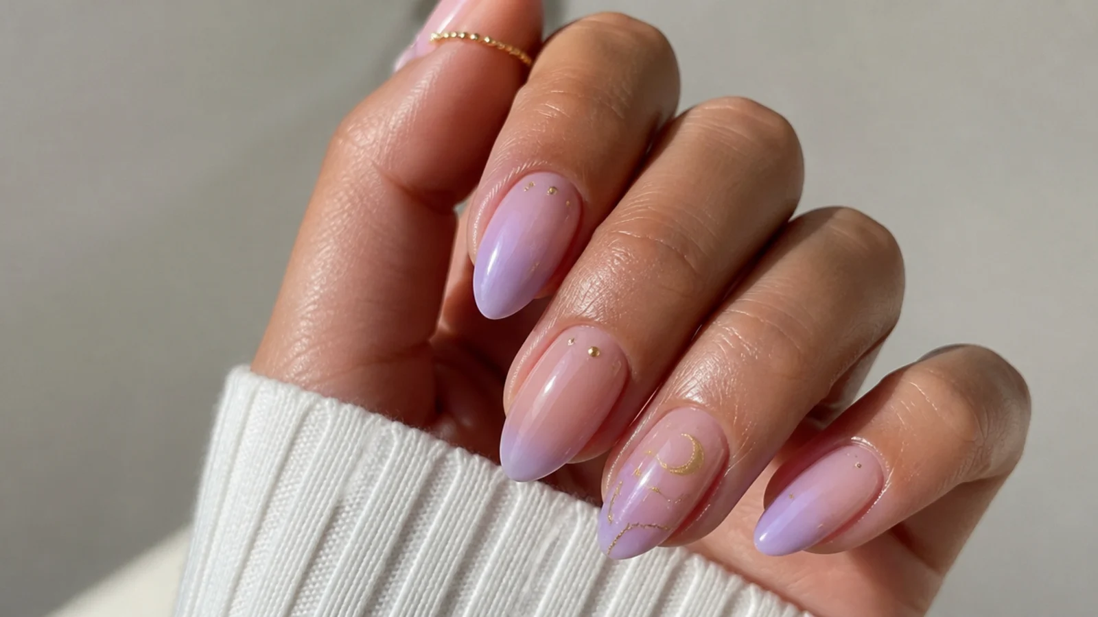 A milky lavender being built in thin sheer coats over a nude base