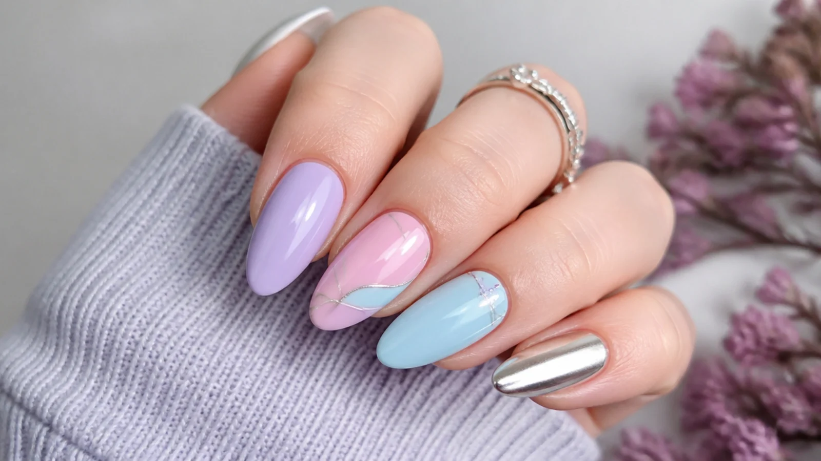 Lavender nails shown beside soft pink, baby blue, white and silver chrome accents