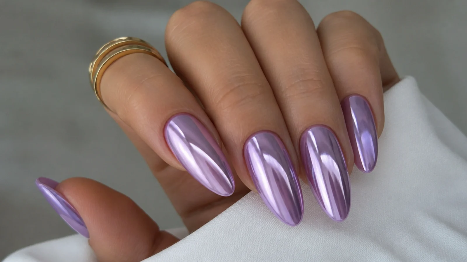 Mirror-chrome lavender acrylic nails with a reflective metallic finish