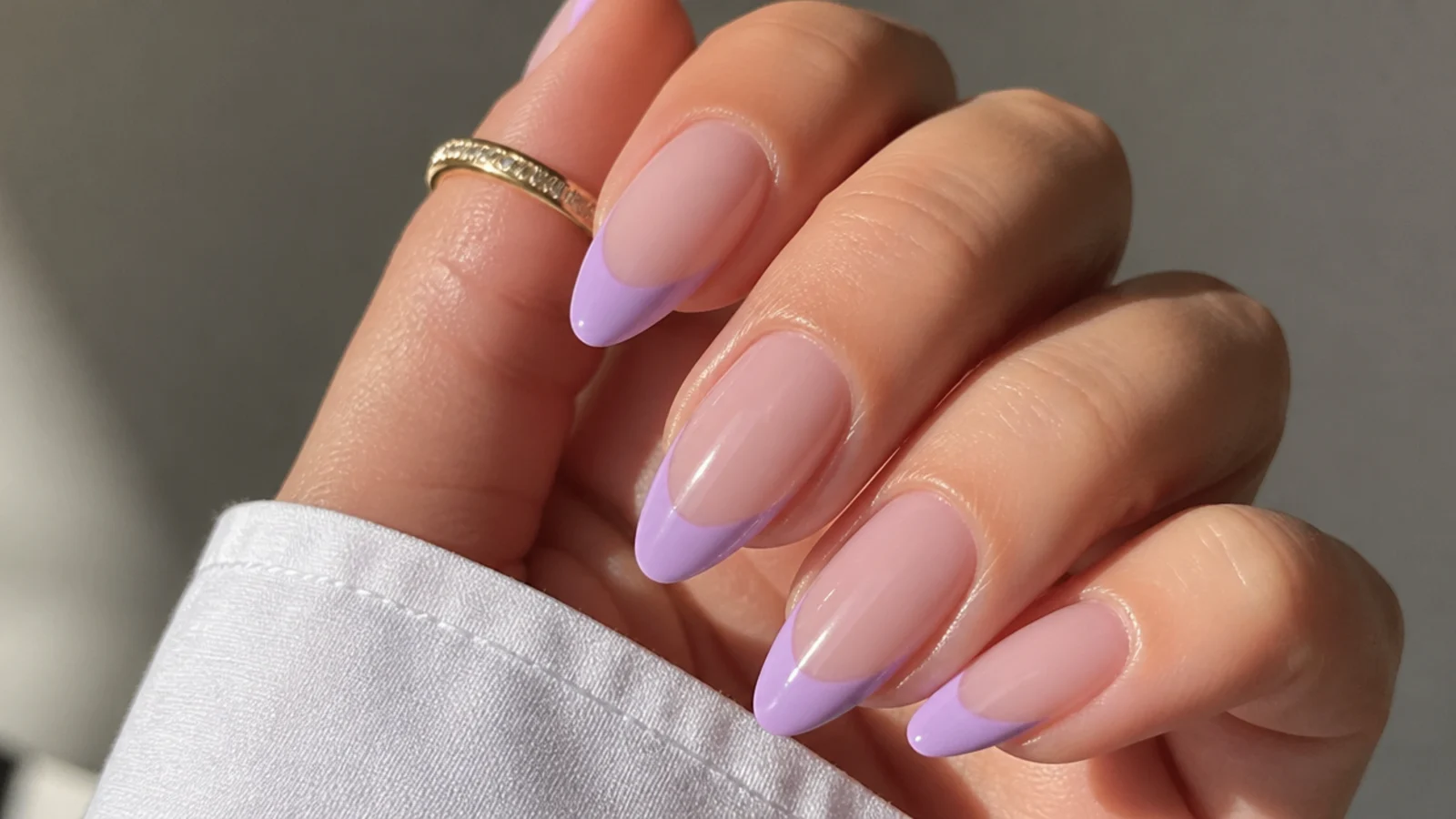 Milky lavender French tip acrylic nails with soft lilac tips