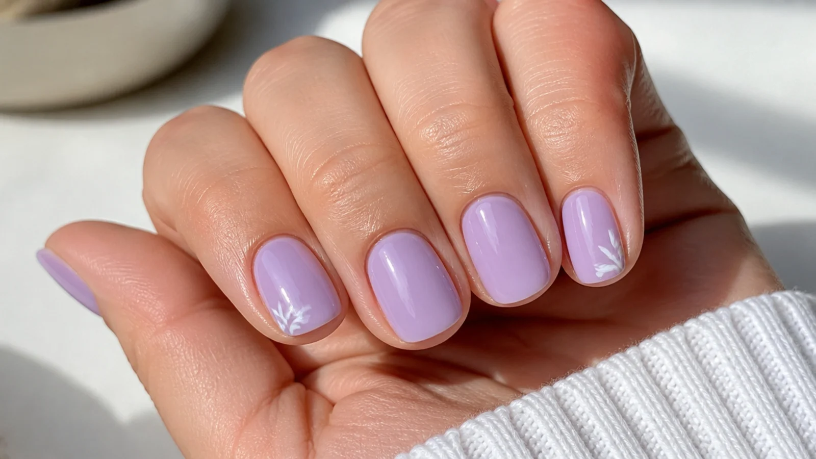 Short round lavender acrylic nails with a glossy milky finish