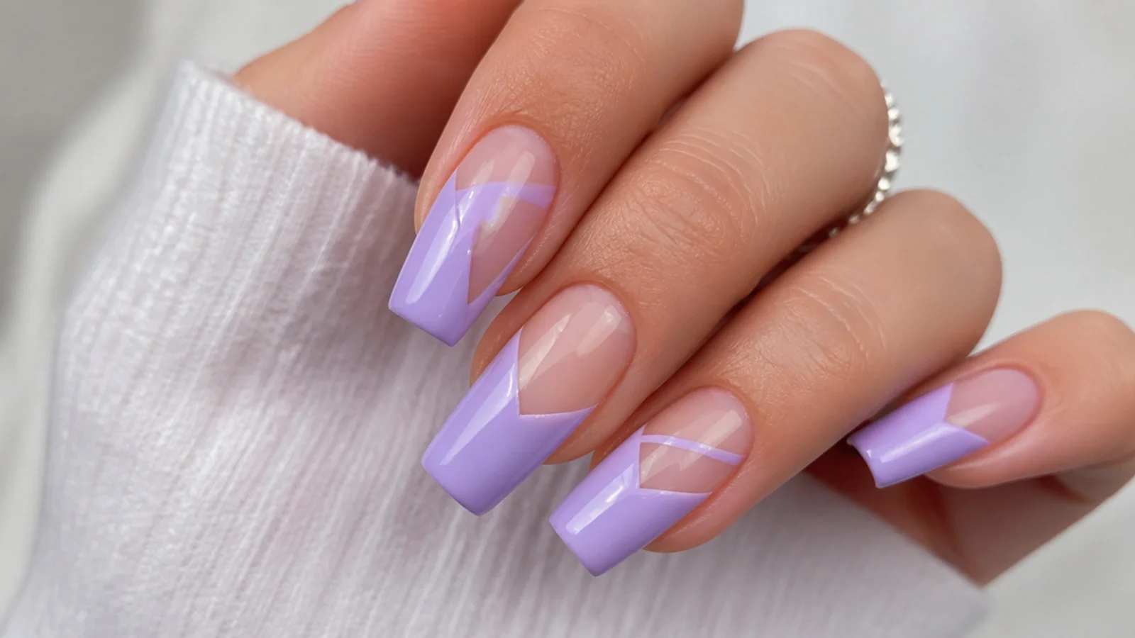 Lavender acrylic nails with clear negative-space geometric gaps