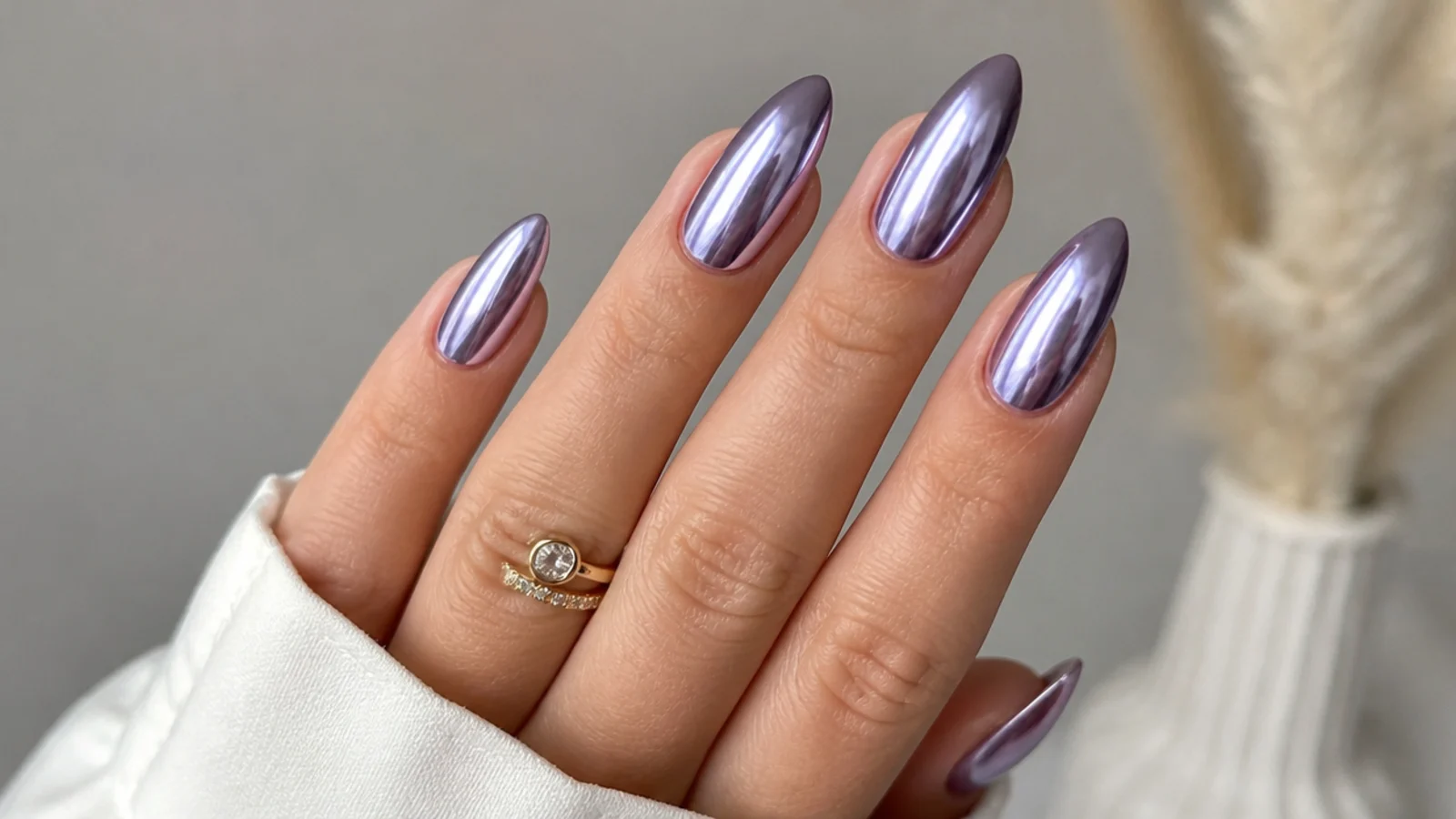 High-shine cool lavender chrome almond nails with a mirror finish