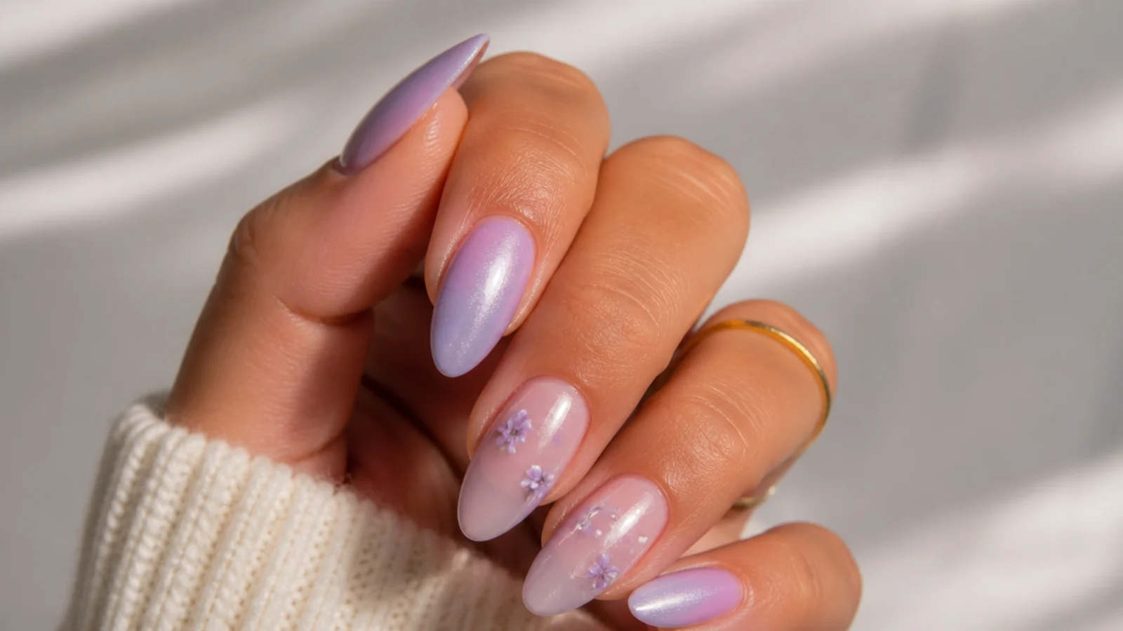 Warm pink-toned lavender almond nails on tan skin