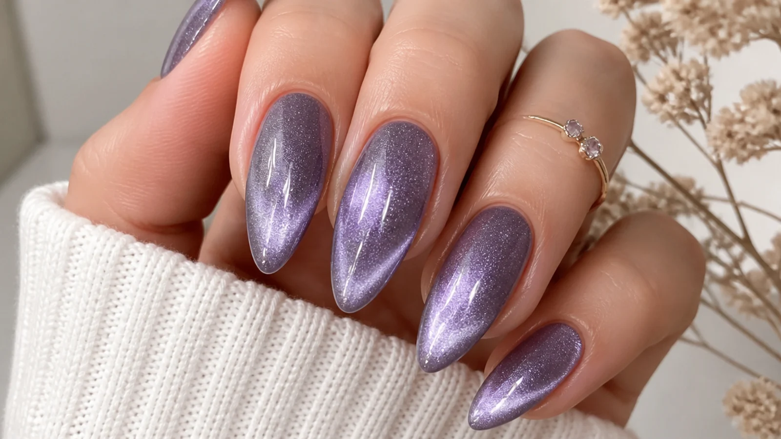 Lavender cat-eye almond nails with a shimmering magnetic light strip