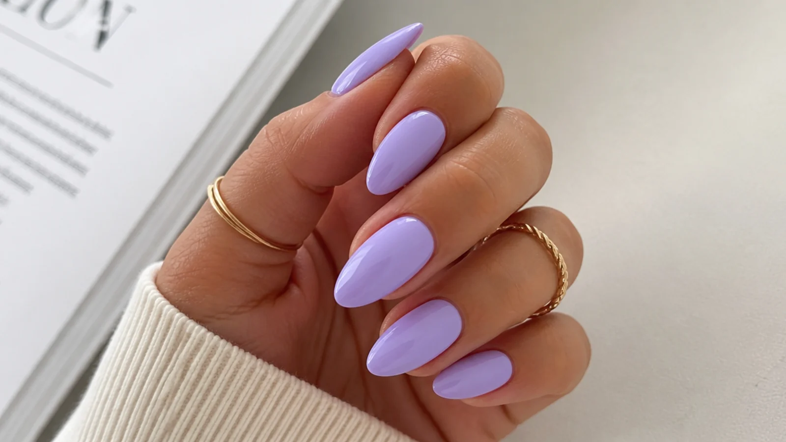 Pale light lavender almond nails with a clean glossy finish