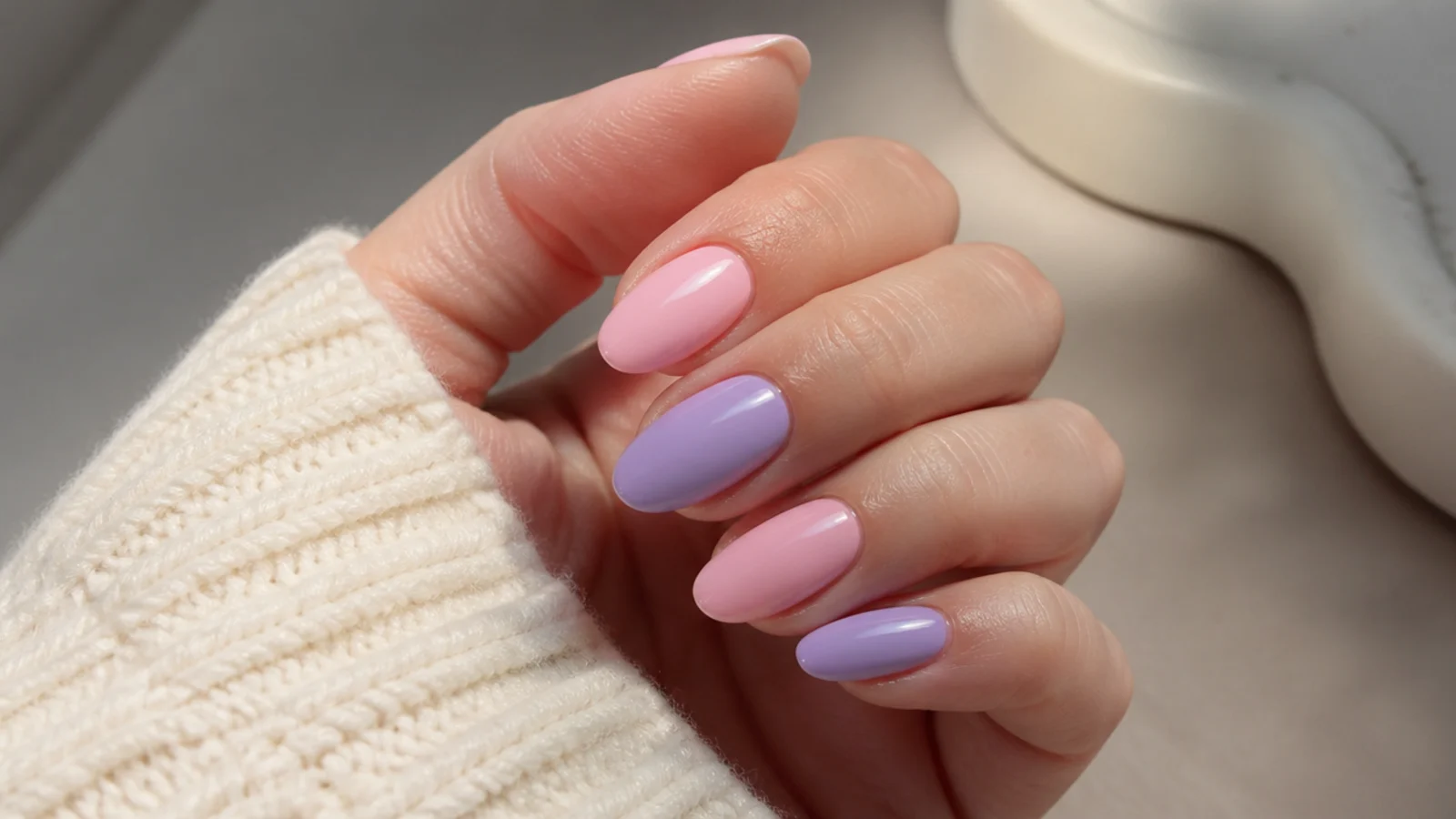 Alternating soft pink and lavender almond nails in a color block set