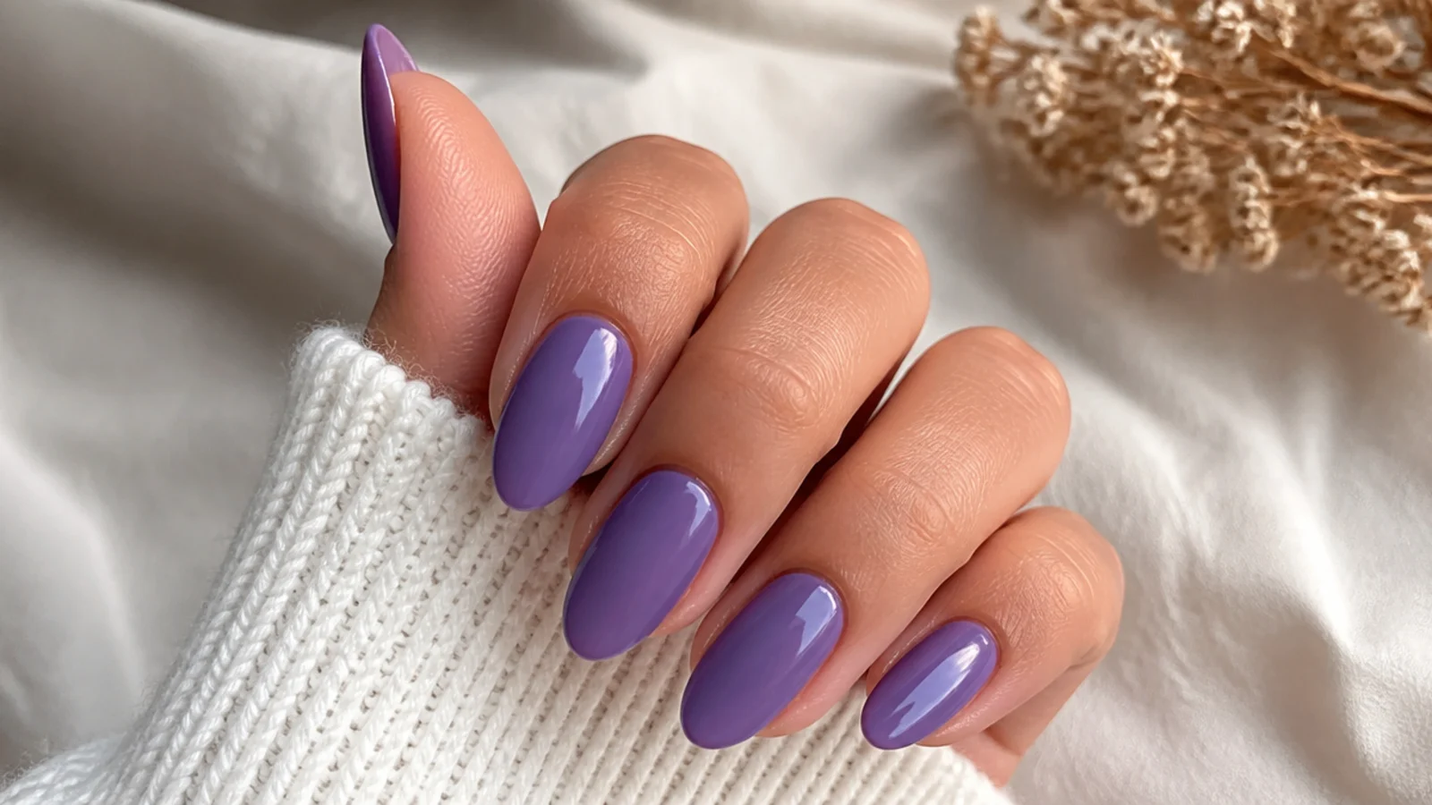 Rich saturated deep lavender almond nails with a glossy finish