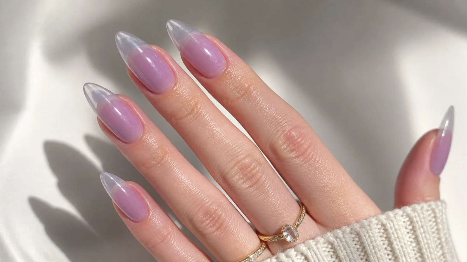 Translucent lavender jelly almond nails with a glossy see-through finish