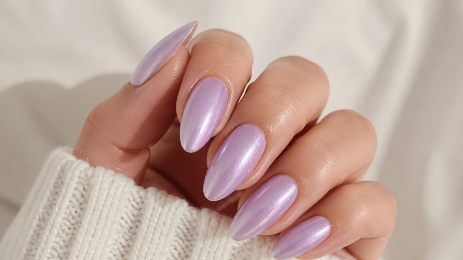 Lavender almond nails with a soft pearlescent shimmer finish
