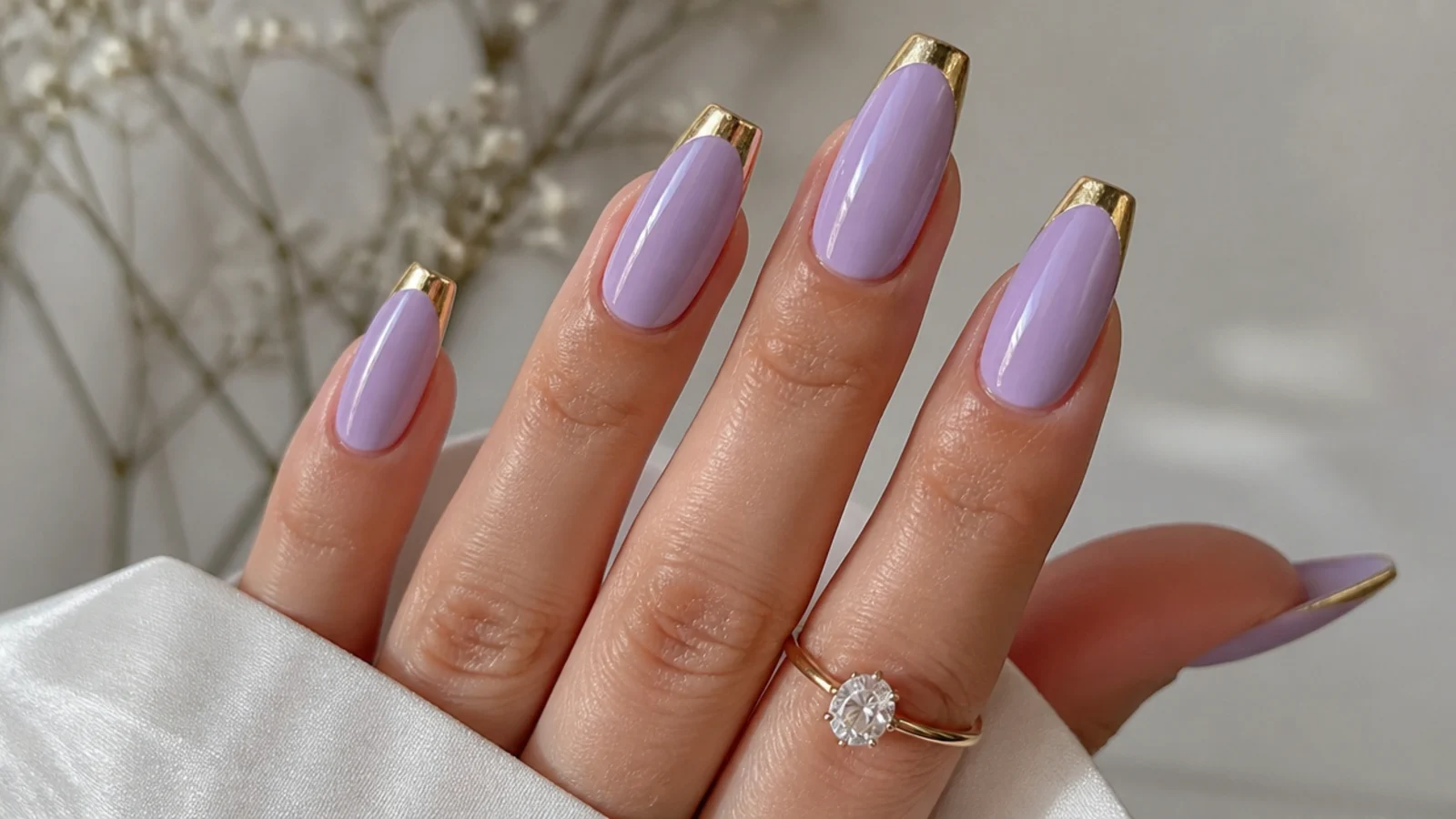 Lavender nails with mirror gold chrome tips on coffin shape