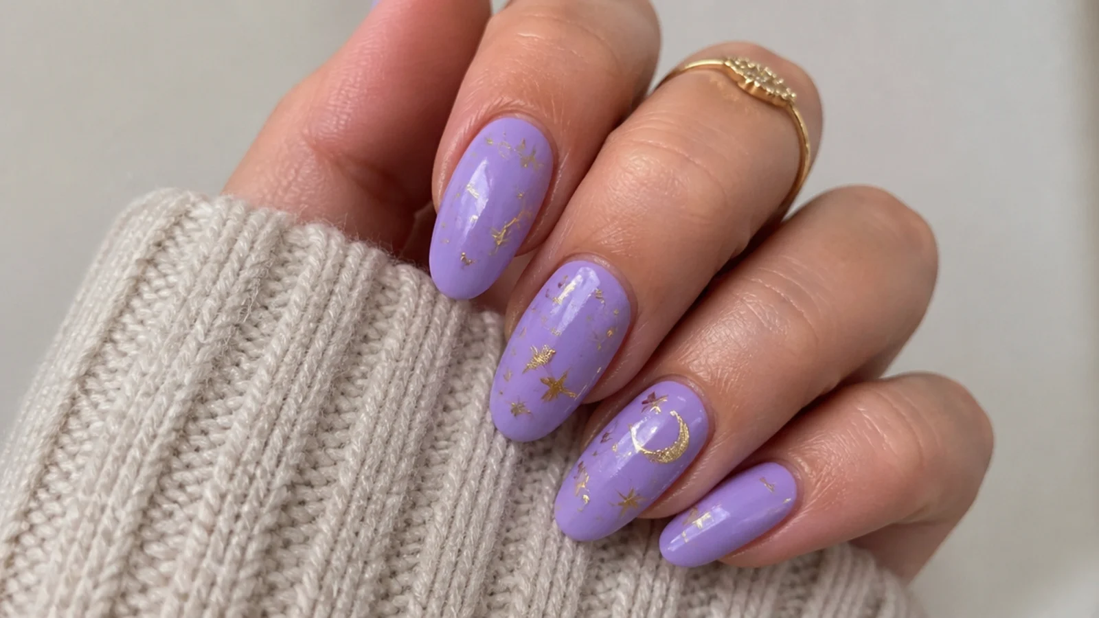 Lavender nails with tiny gold star and celestial accents