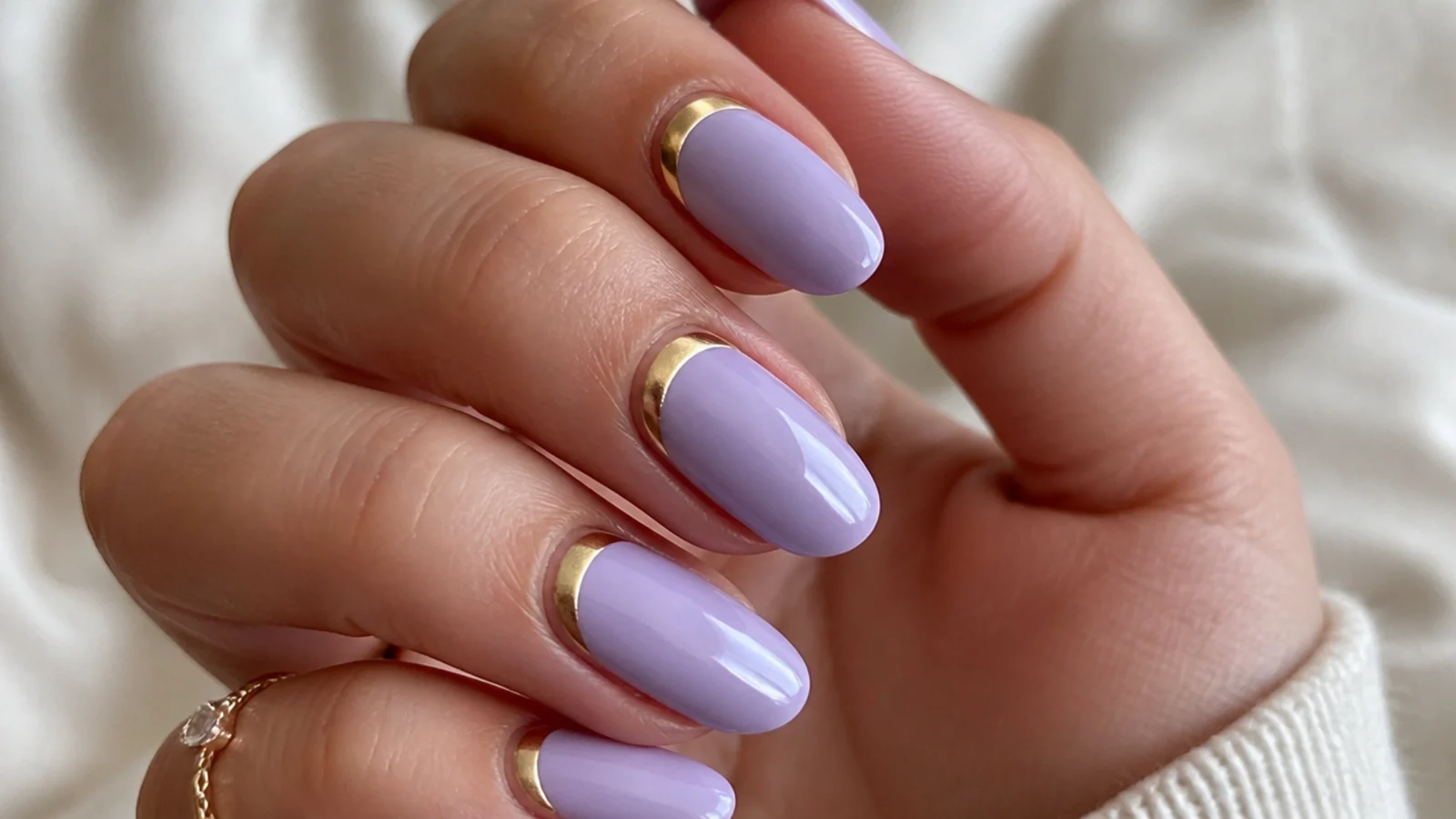 Lavender nails with gold half-moon cuticle accents