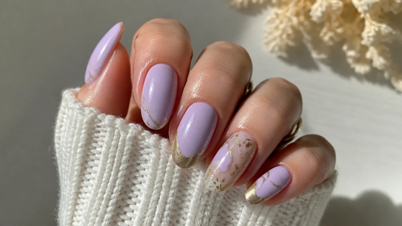 A sealed lavender and gold manicure with cuticle oil for longevity