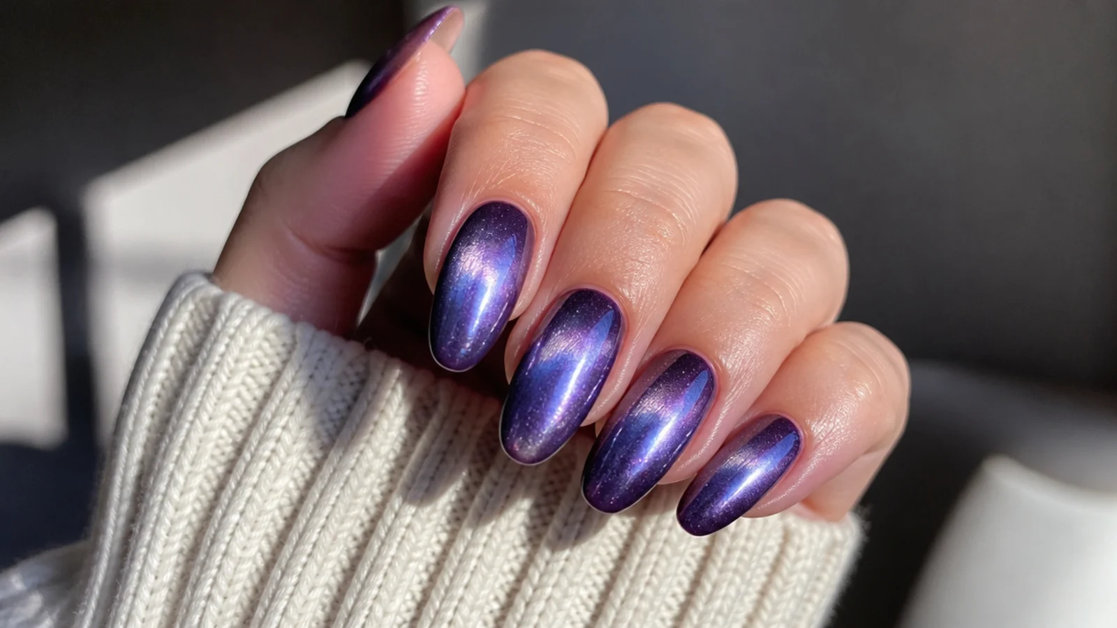 Deep purple lavender cat eye nails with a bright galaxy-like light band