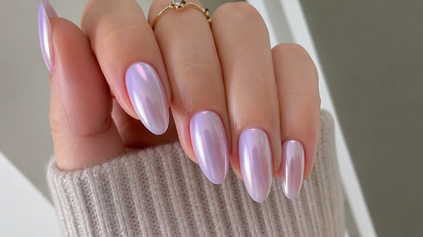 Soft milky lavender chrome nails with a low pearly sheen