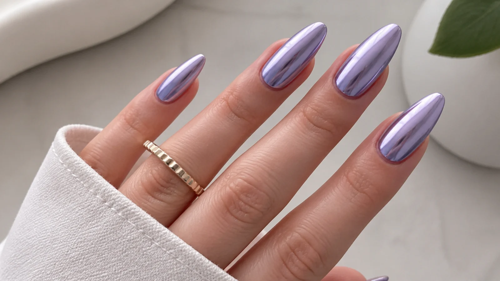 Cool blue-toned lavender chrome mirror nails on fair skin