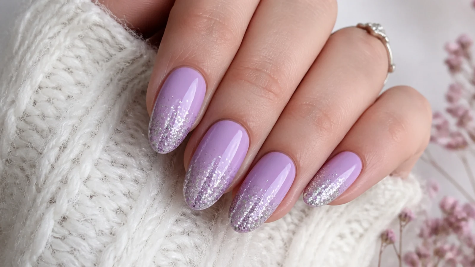 Lavender nails with sparkling silver glitter fading up from the tips