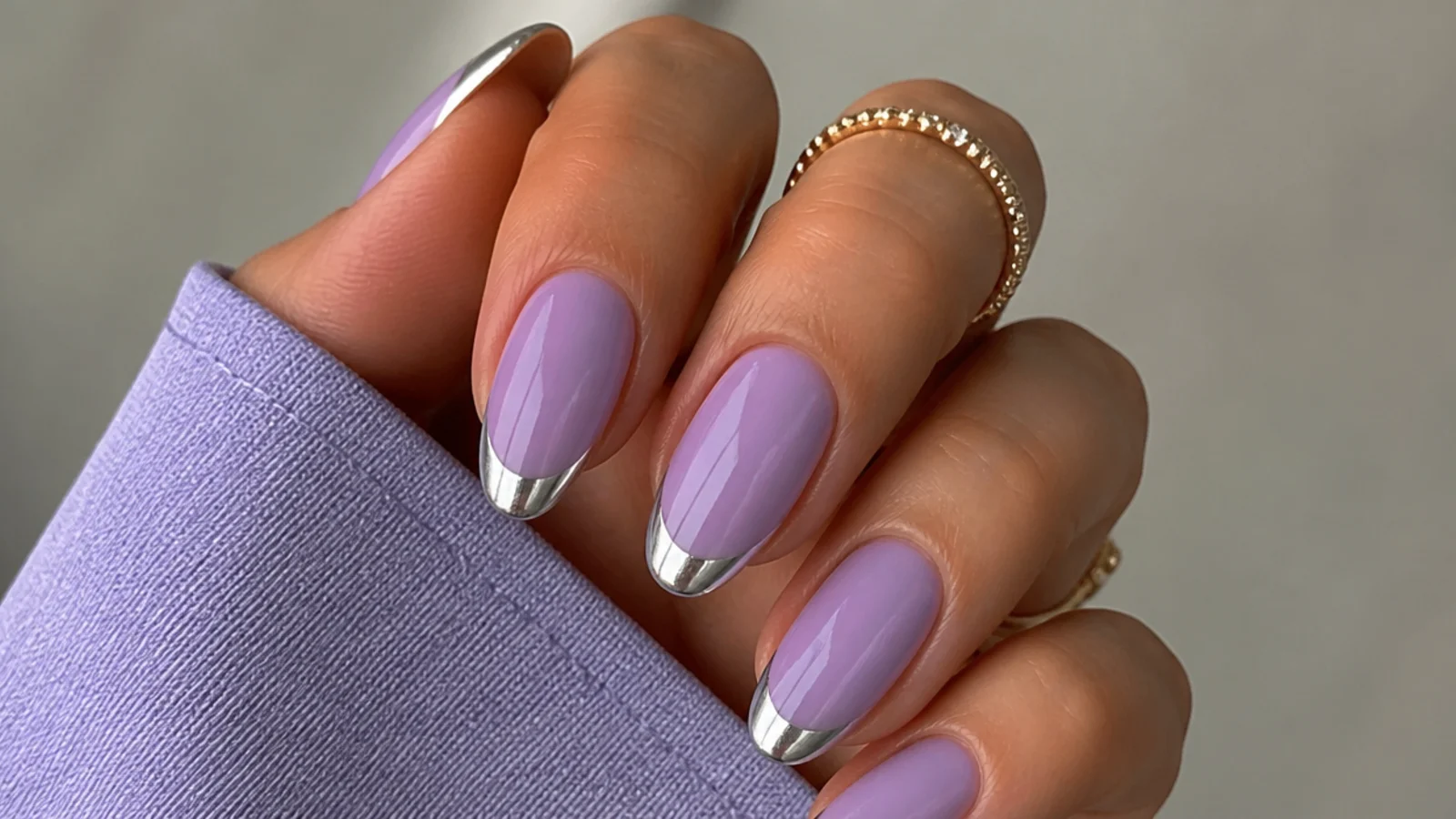 Milky lavender nails with mirror silver chrome French tips