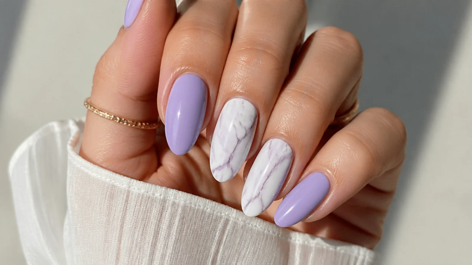 Lavender and white marble nails with fine gray veining
