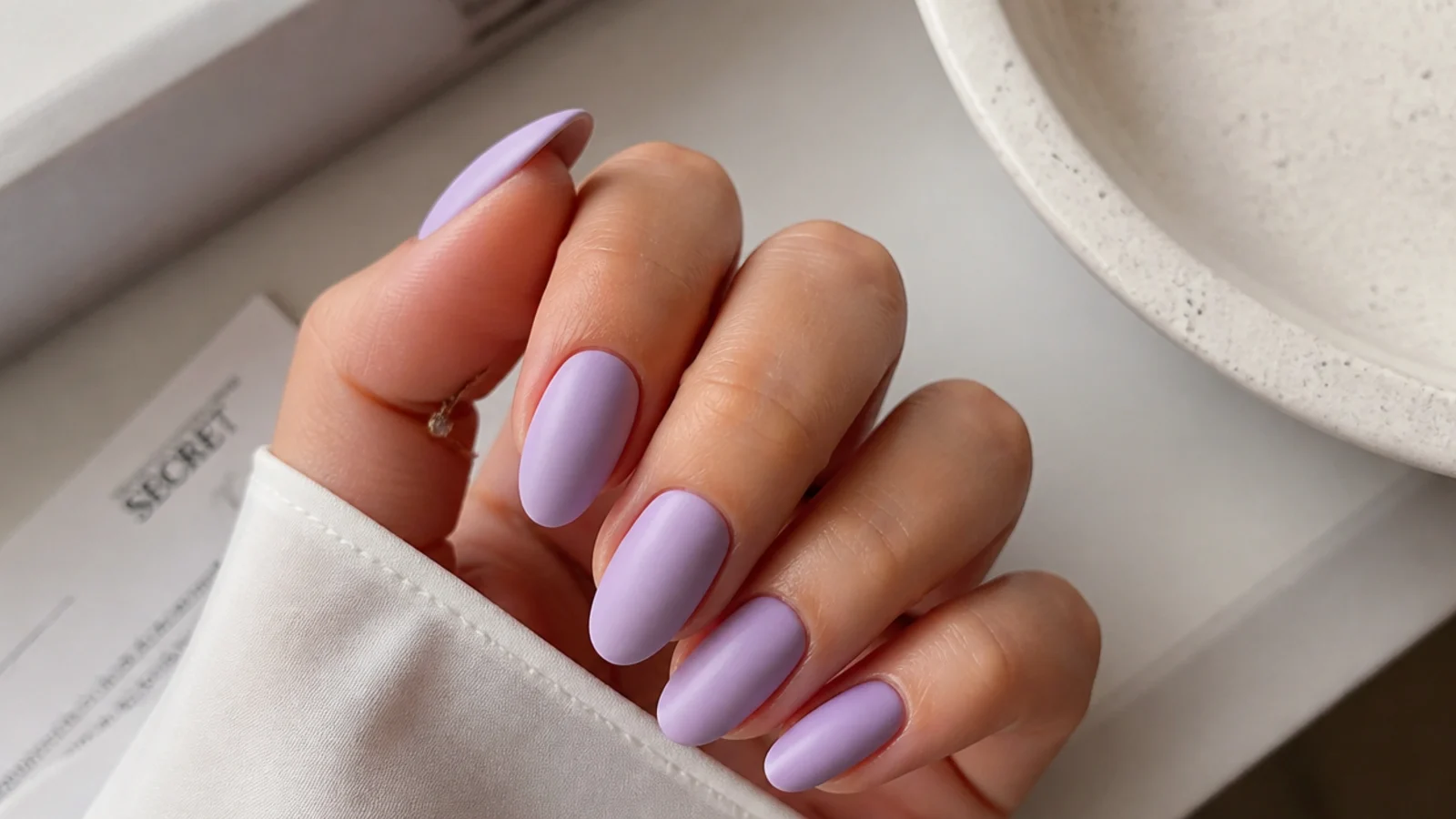 Soft lavender nails with a smooth matte velvet finish and no shine