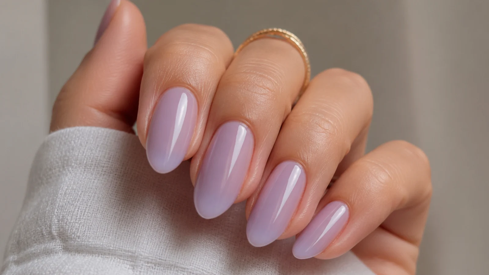 Semi-sheer milky lavender nails with a glazed finish