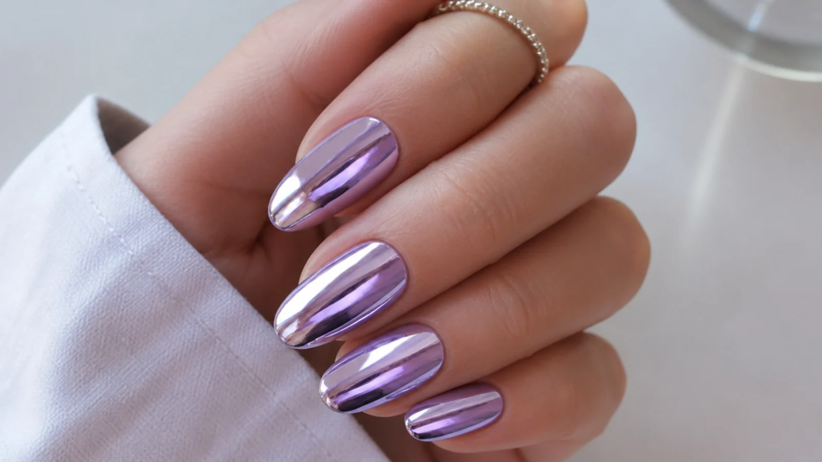 Mirror-finish lavender chrome nails with a metallic shine