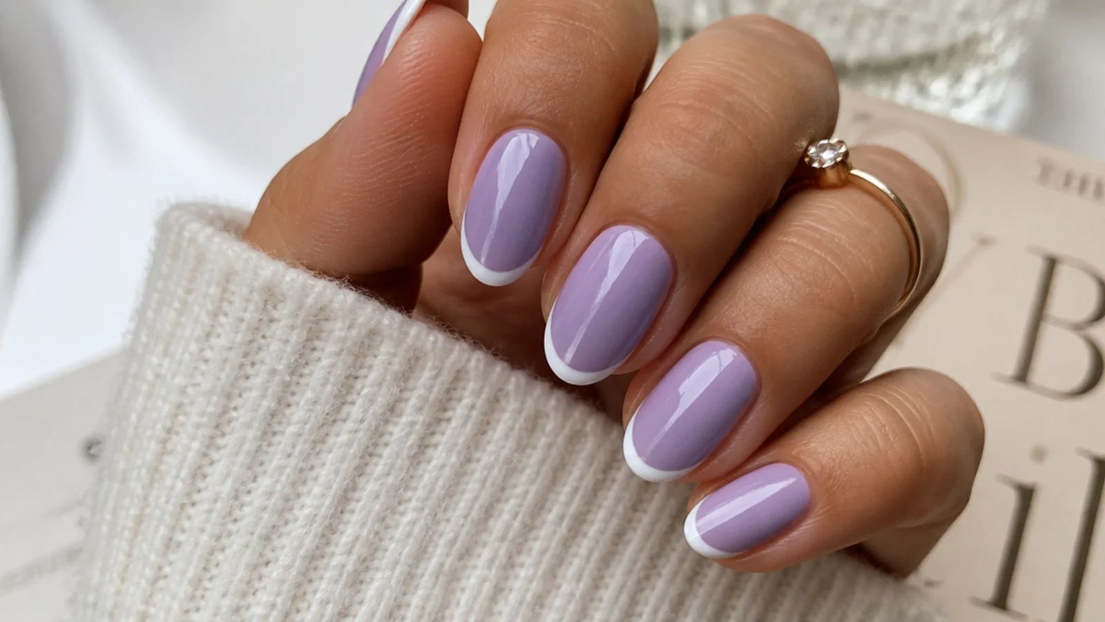 Soft lavender nails with a thin white French tip