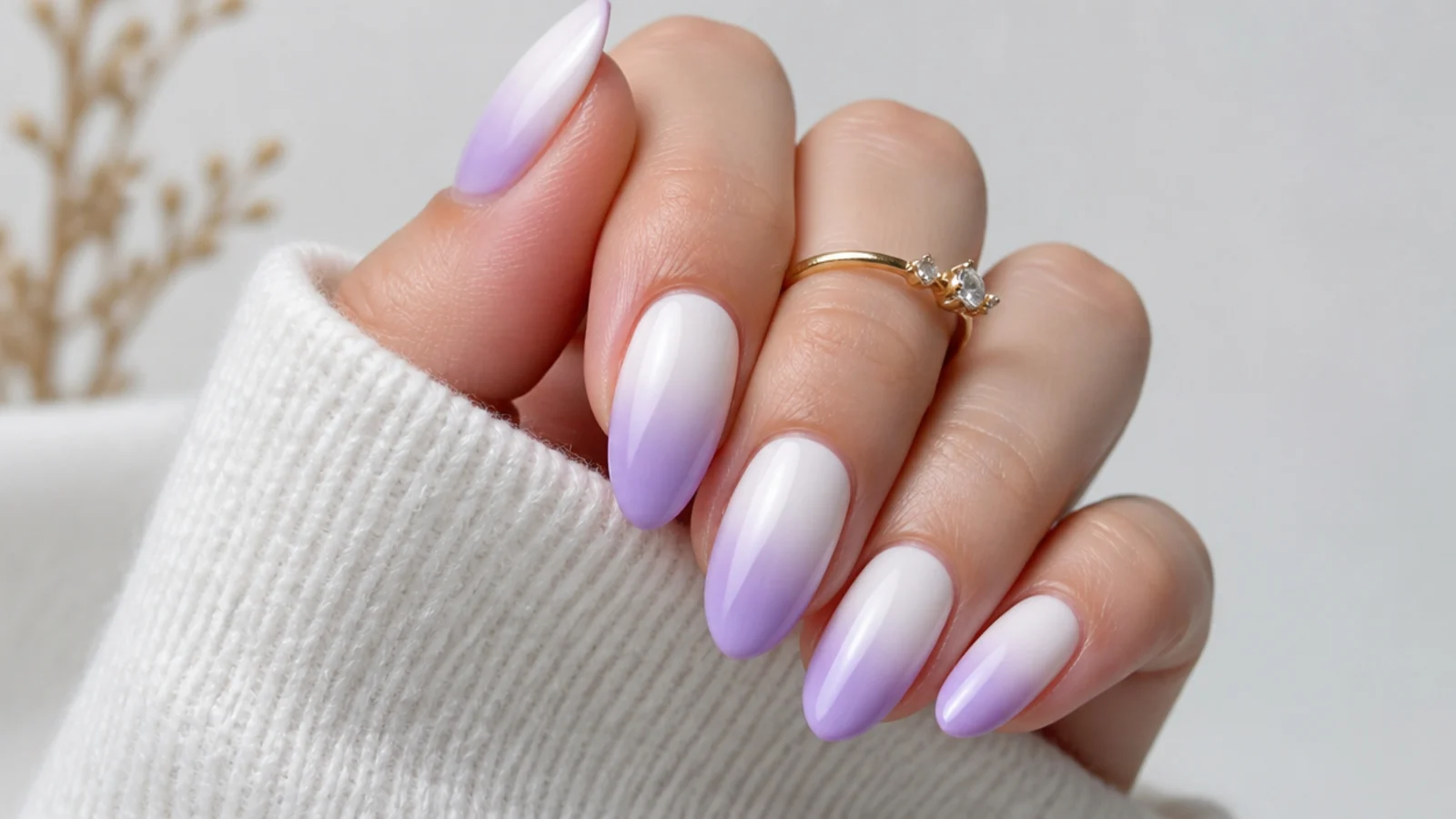 Lavender ombre nails fading from white to soft lilac