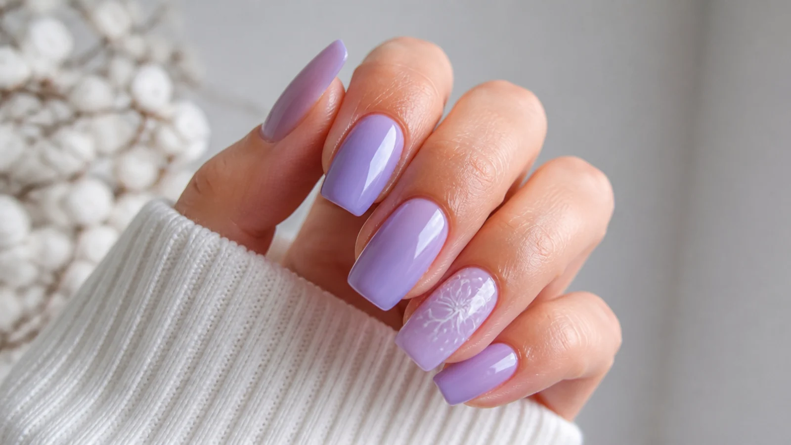 A well-sealed glossy lavender manicure with cuticle oil