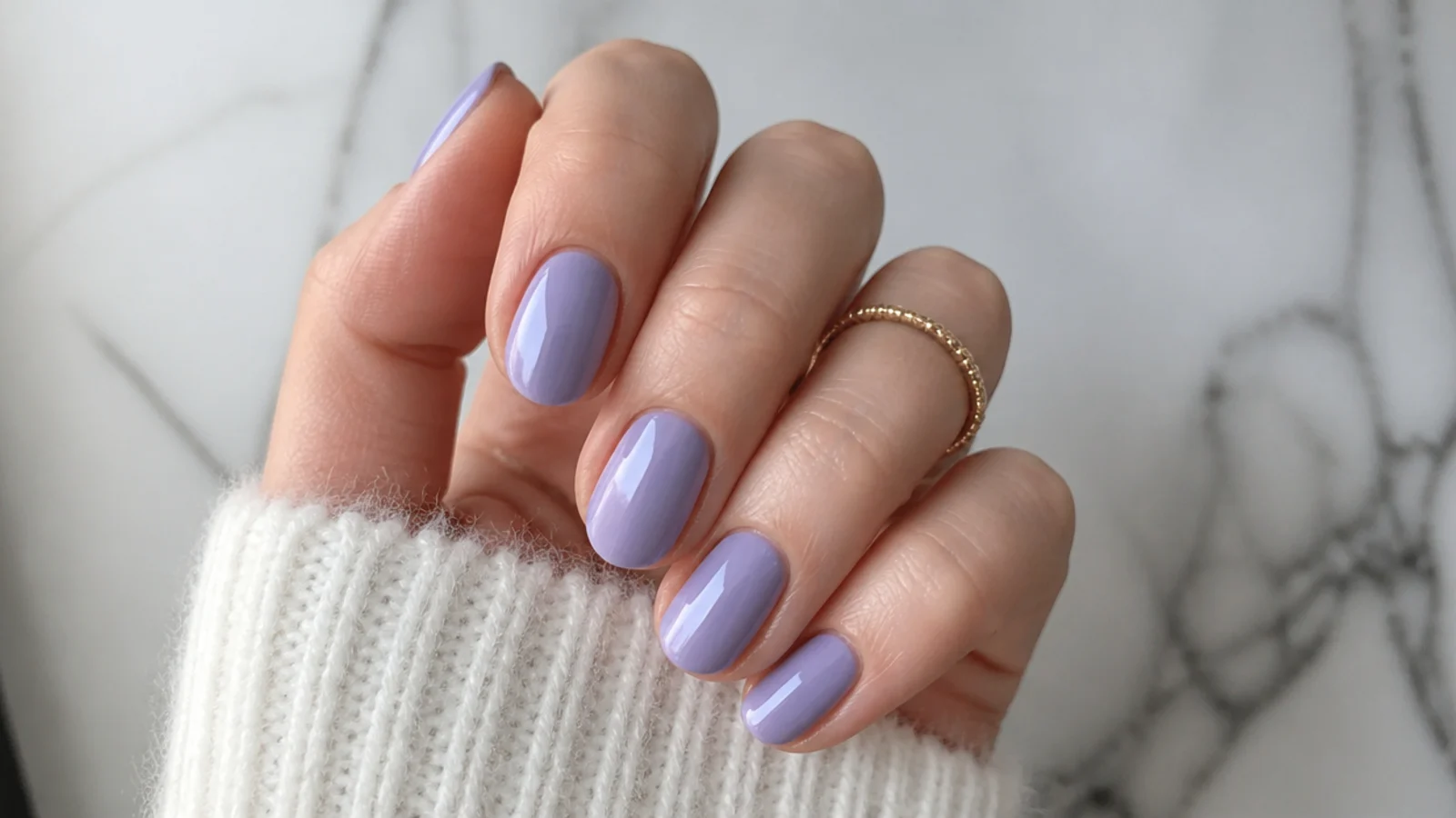 Cool blue-toned true lavender nails on fair skin, solid opaque finish