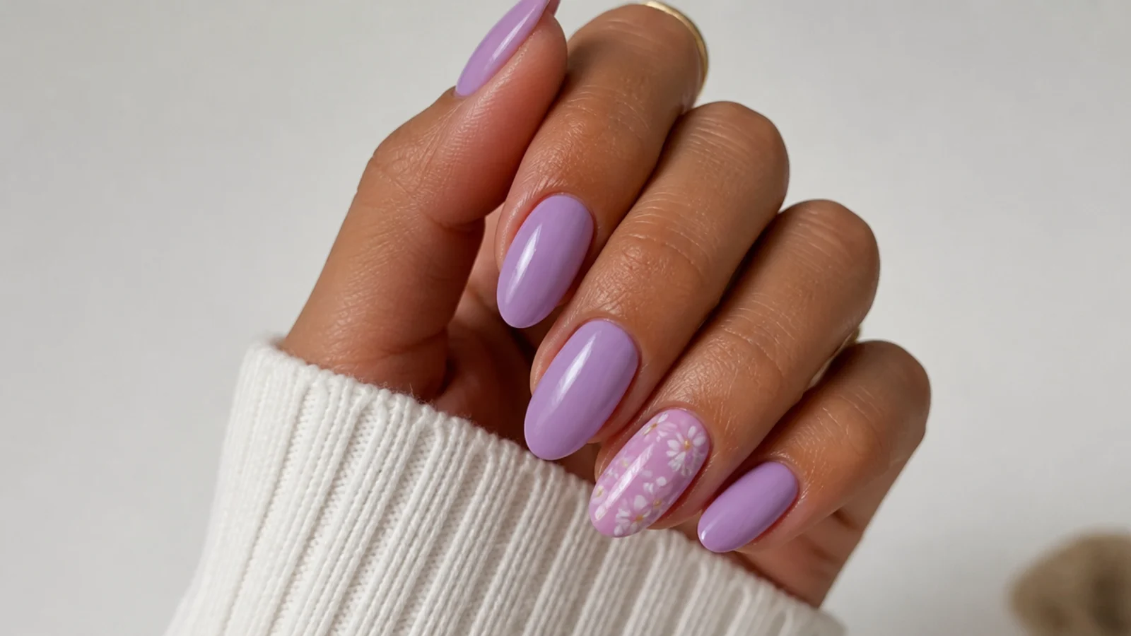 Warm pink-toned lavender nails on tan skin, soft opaque finish