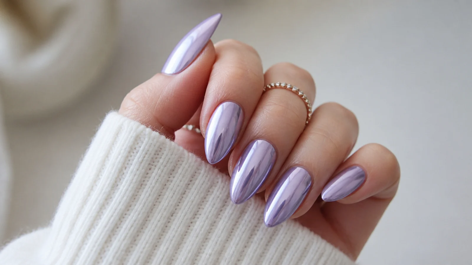 High-shine lavender chrome mirror nails on almond shape