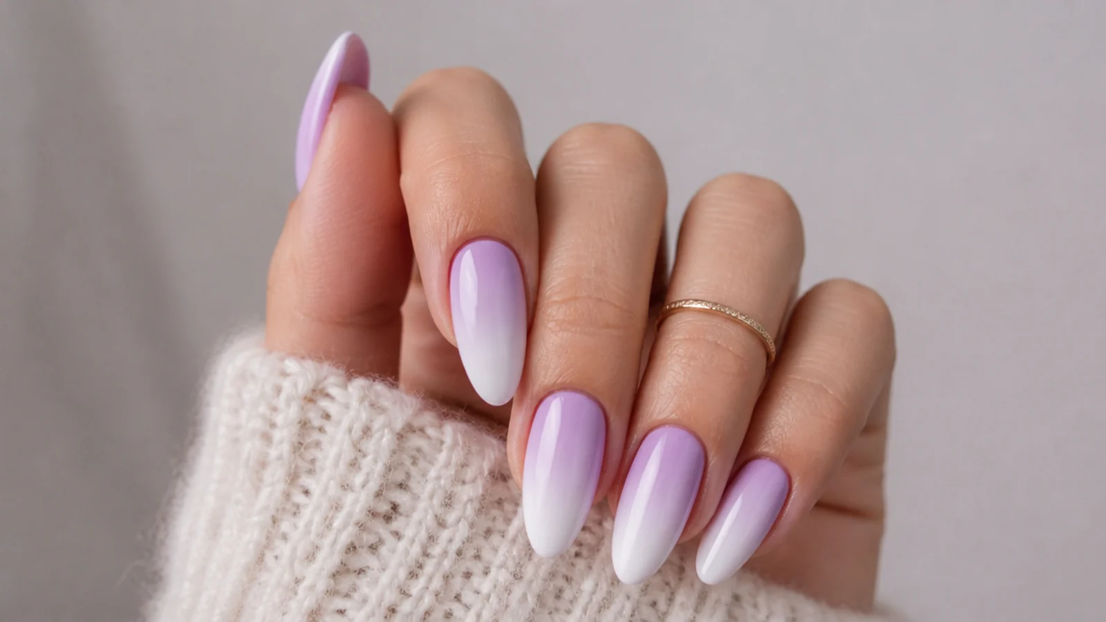 Soft lavender fading to white ombre nails on almond shape
