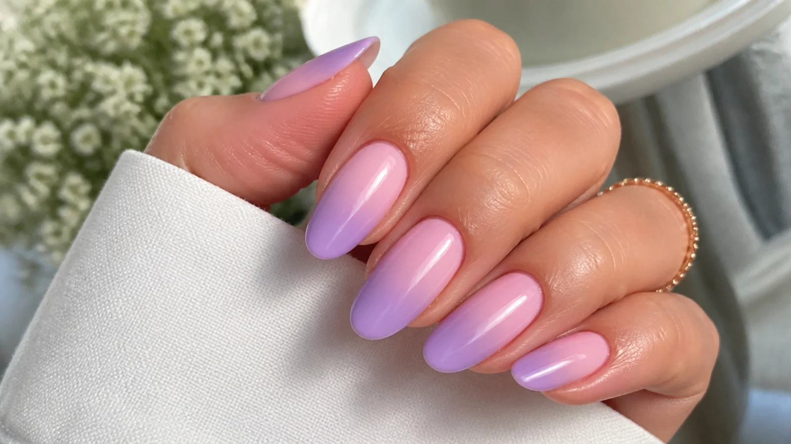 Baby pink blending into soft lavender ombre nails