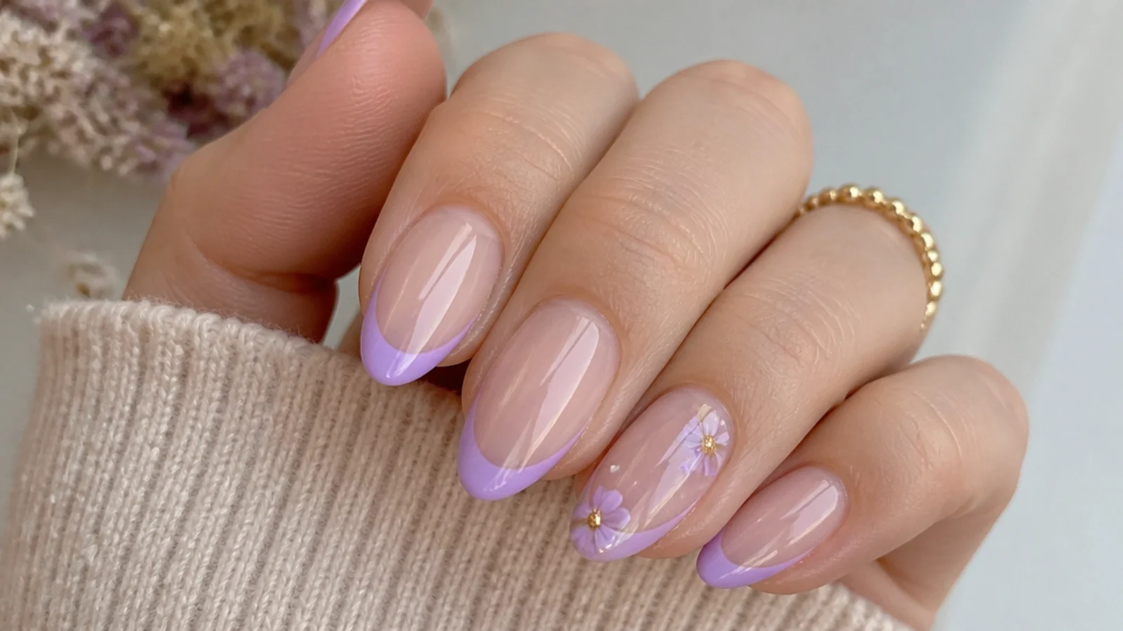 Clean lavender French tip nails on a natural nude base
